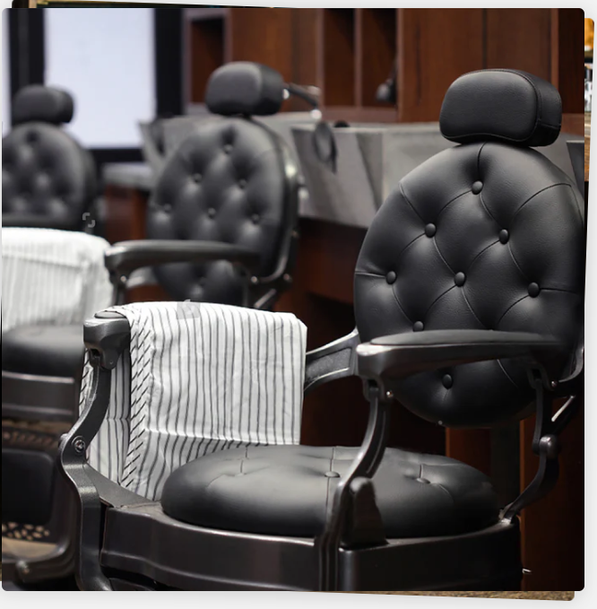 Classic black barber chairs in a salon